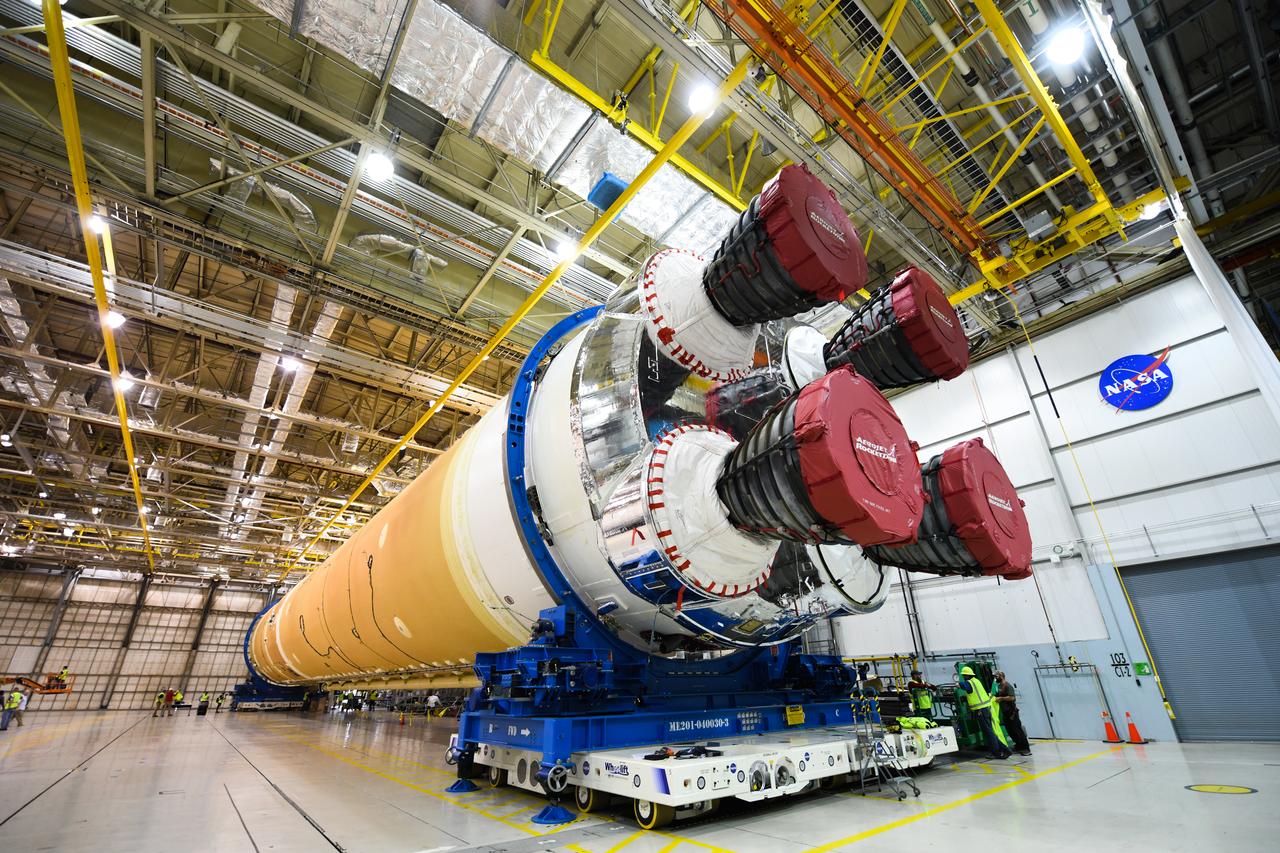 These images show how teams at NASA’s Michoud Assembly Facility in New Orleans moved the core stage, complete with all four RS-25 engines, for NASA’s Space Launch System (SLS) rocket to Building 110 for final shipping preparations on Jan. 1. The SLS core stage includes state-of-the-art avionics, propulsion systems and two colossal propellant tanks that collectively hold 733,000 gallons of liquid oxygen and liquid hydrogen to power its four RS-25 engines. The completed stage, which will provide more than 2 million pounds of thrust to help power the first Artemis mission to the Moon, will be shipped via the agency’s Pegasus barge from Michoud to NASA’s Stennis Space Center near Bay St. Louis, Mississippi, later this month. Once at Stennis, the Artemis rocket stage will be loaded into the B-2 Test Stand for the core stage Green Run test series. The comprehensive test campaign will progressively bring the entire core stage, including its avionics and engines, to life for the first time to verify the stage is fit for flight ahead of the launch of Artemis I.